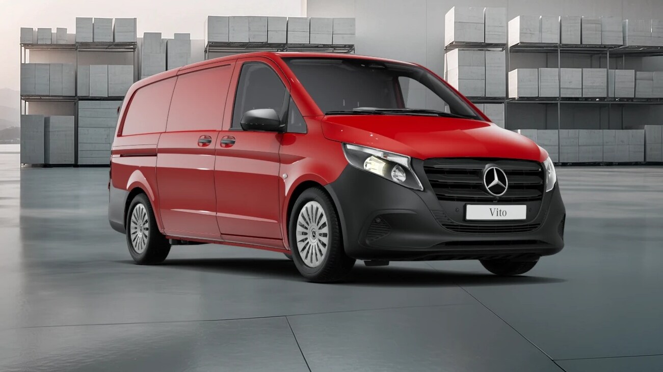 White Mercedes-Benz Vito Panel Van parked by modern concrete structure.